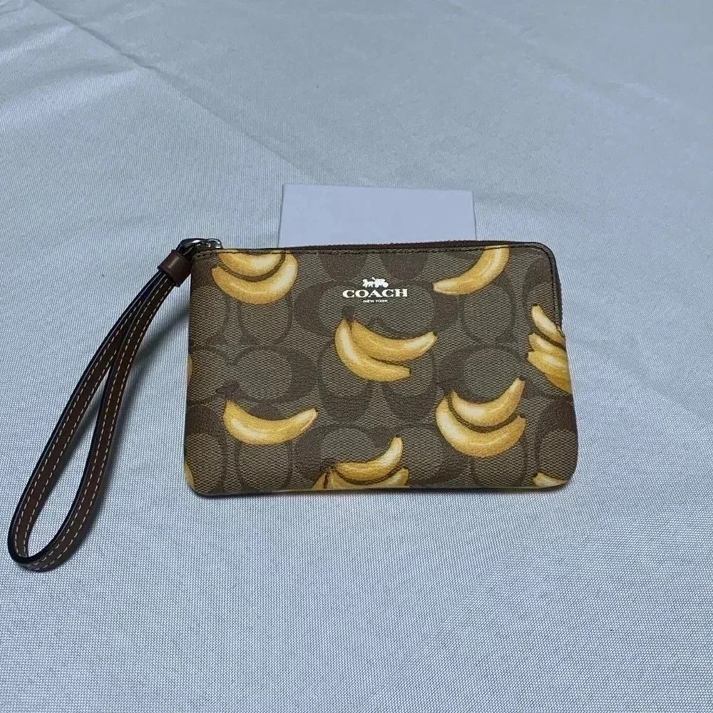 COACH Wristlet, Banana Print. NWT.